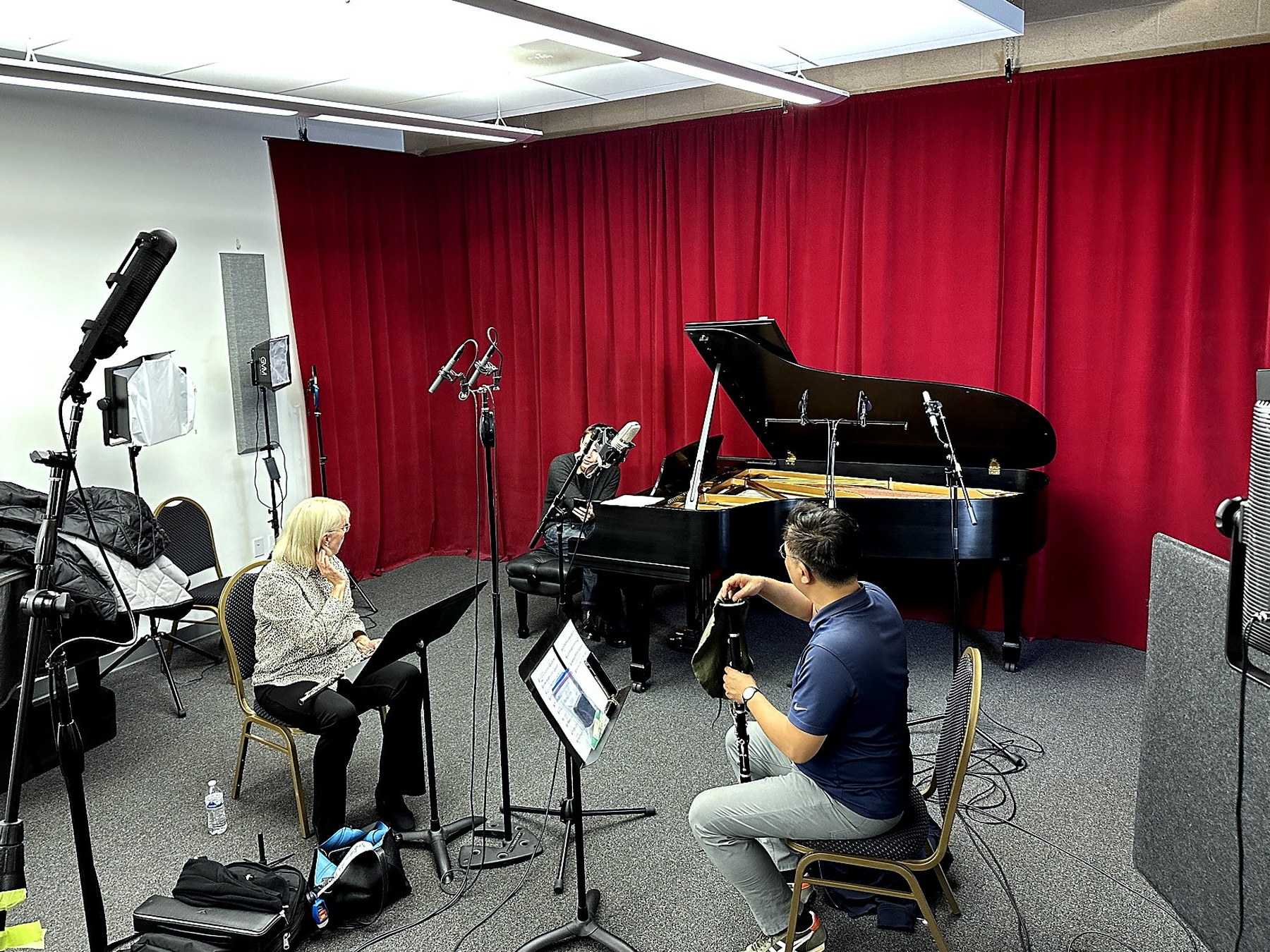 Audition video session in the studio with piano, performer, and camera setup